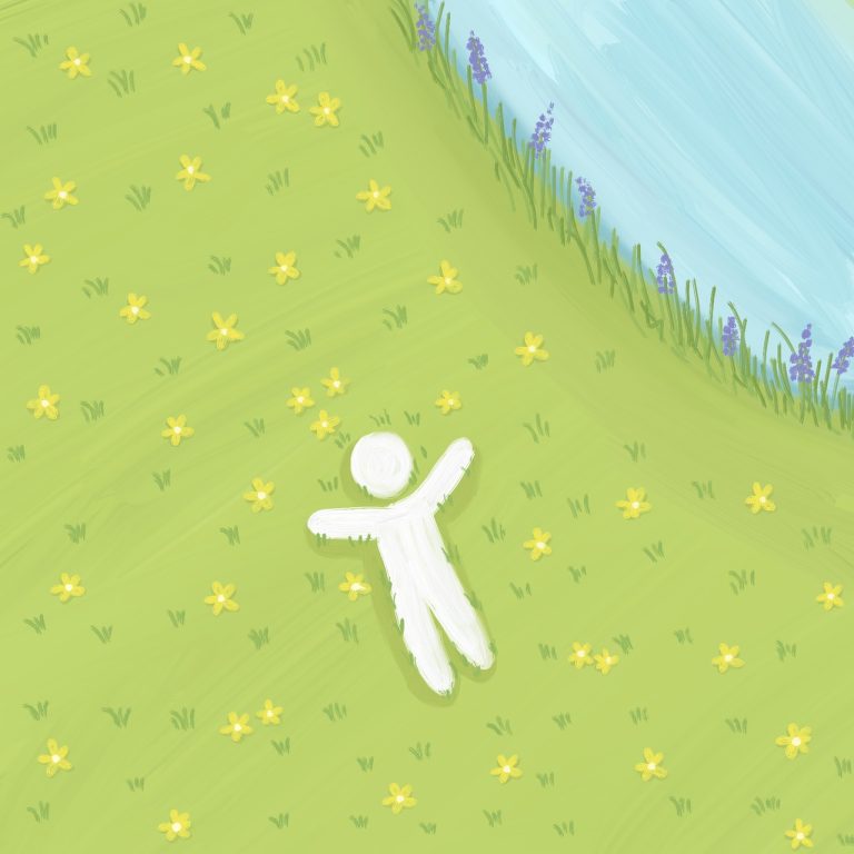 Osoba leżąca na trawie